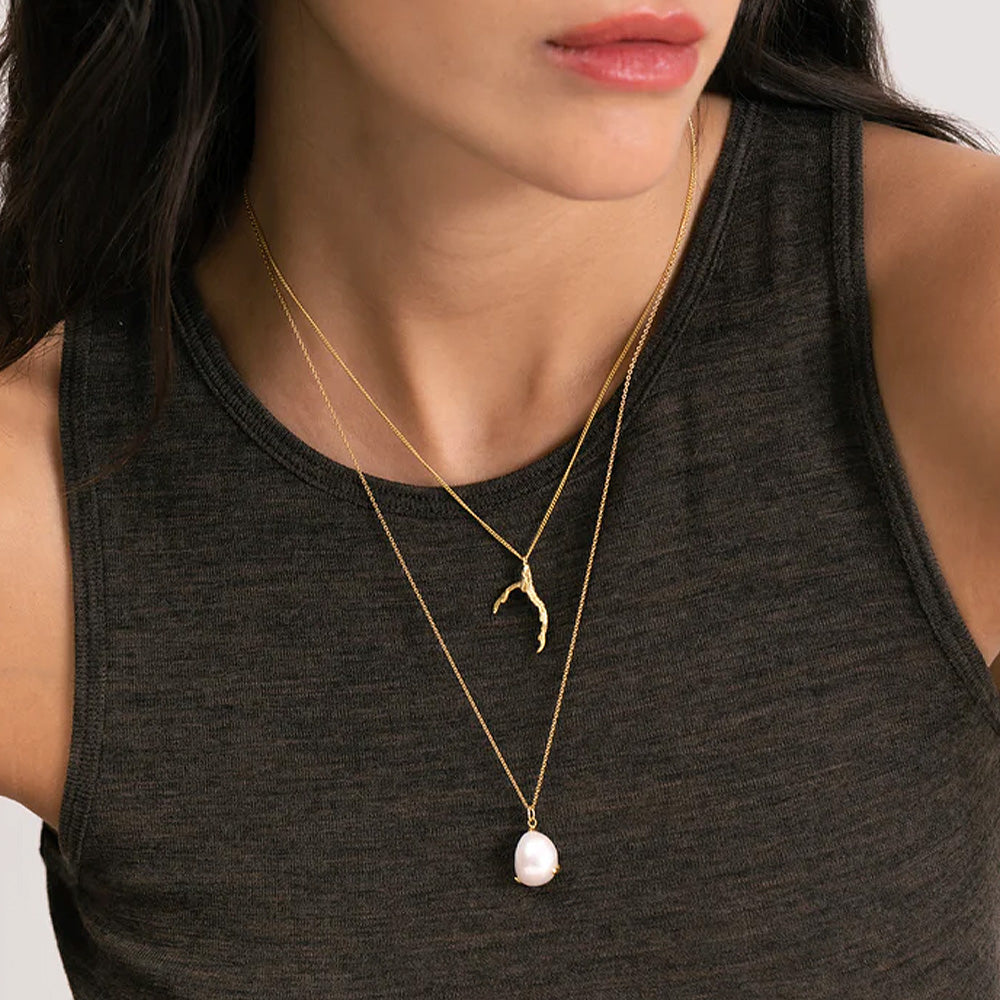 Necklace with signature grigri pendant, 18 ct. gold